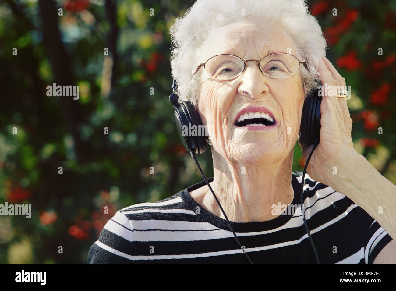 Sherwood Park, Alberta, Canada; A Senior Woman Wearing Headphones Stock Photo Alamy