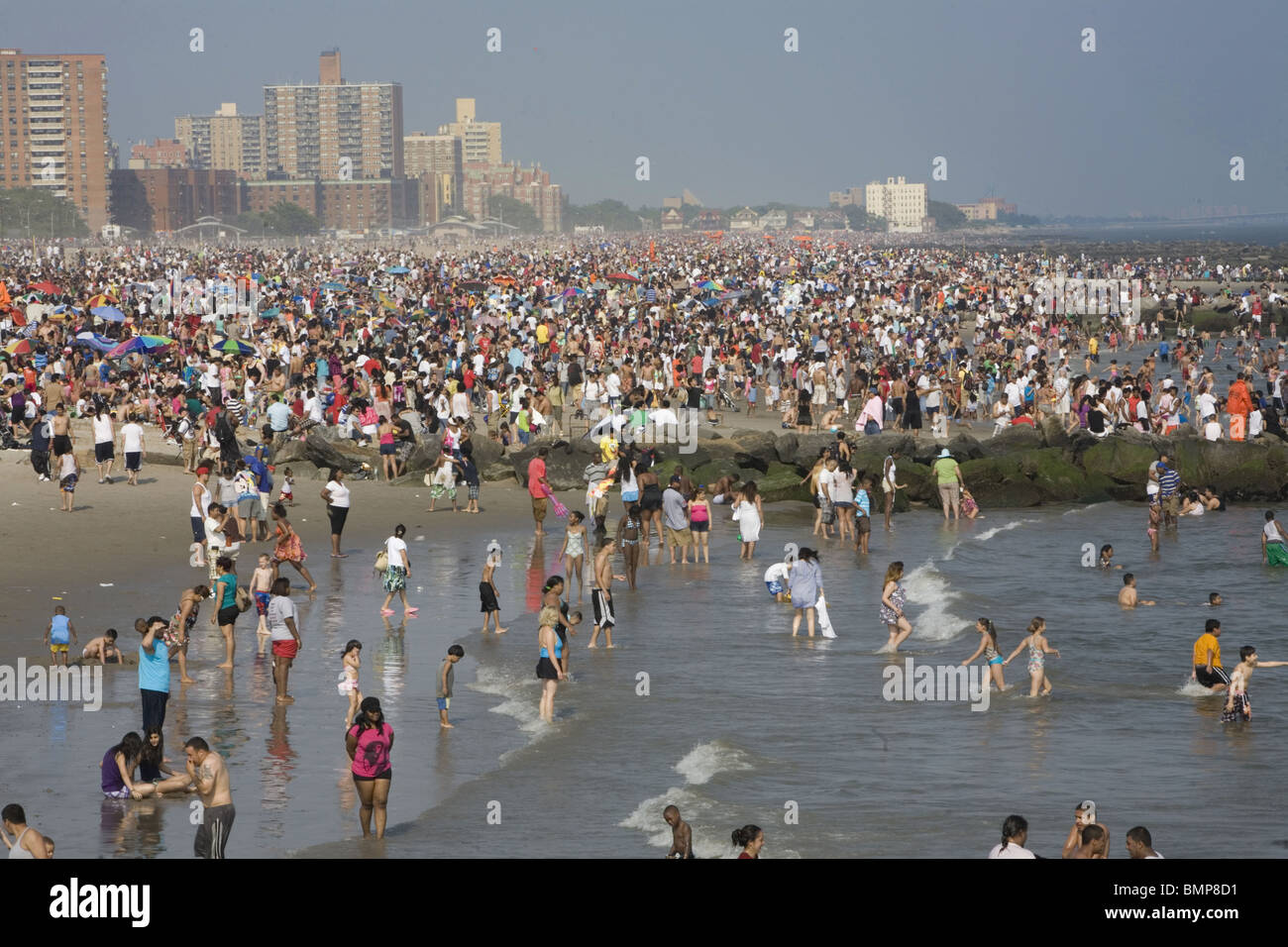 Warm crowded Memorial Day on the beach at Coney Island, Brooklyn, New