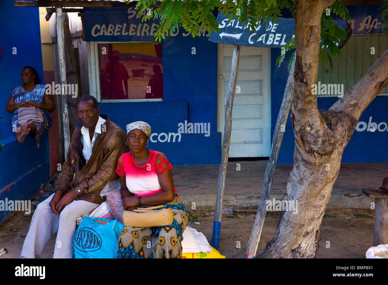 A married couple waiting for the bus in Vilankulos, Mozambique, Africa. Stock Photo