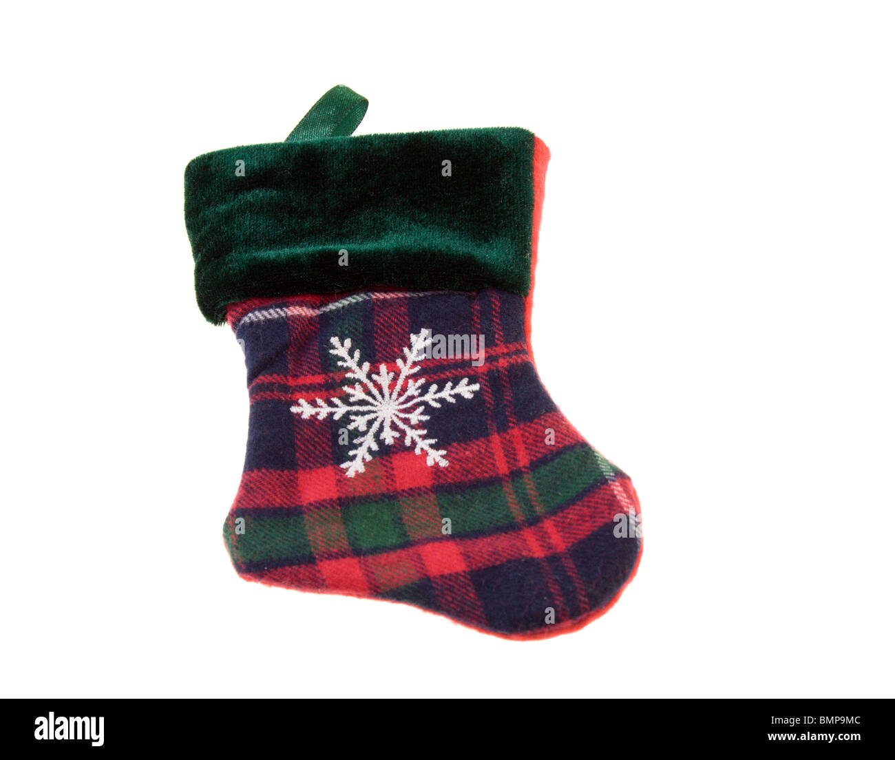 plaid Christmas stocking with large snowflake on white Stock Photo
