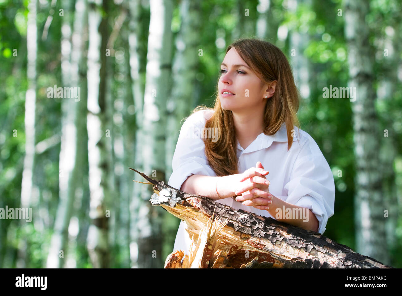 Young woman relaxing in the forest Stock Photo - Alamy