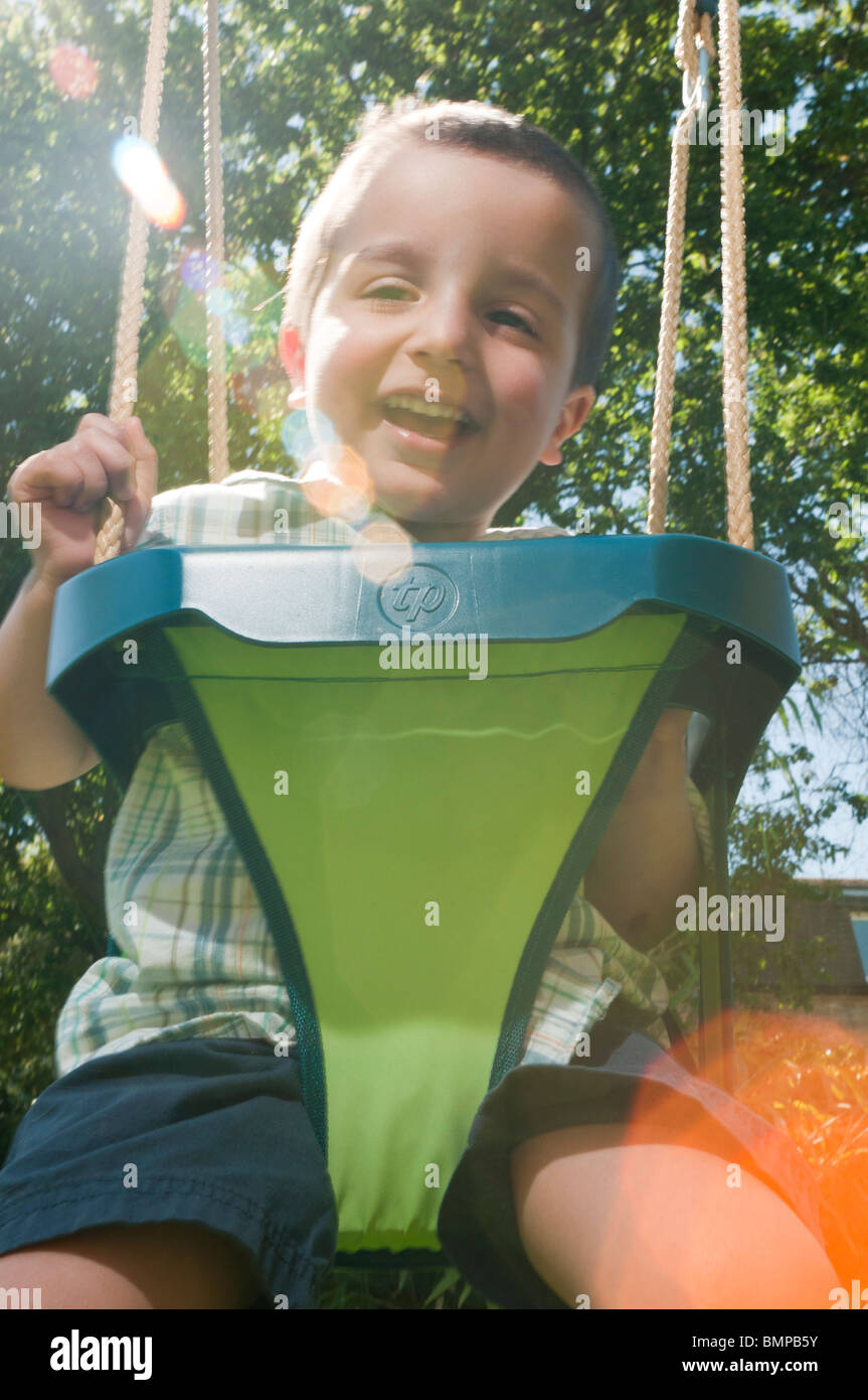 Child on the swing Stock Photo