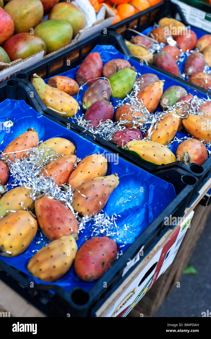 Prickly pear fruits and mangoes for sale at a greengrocer in Paris, France Stock Photo