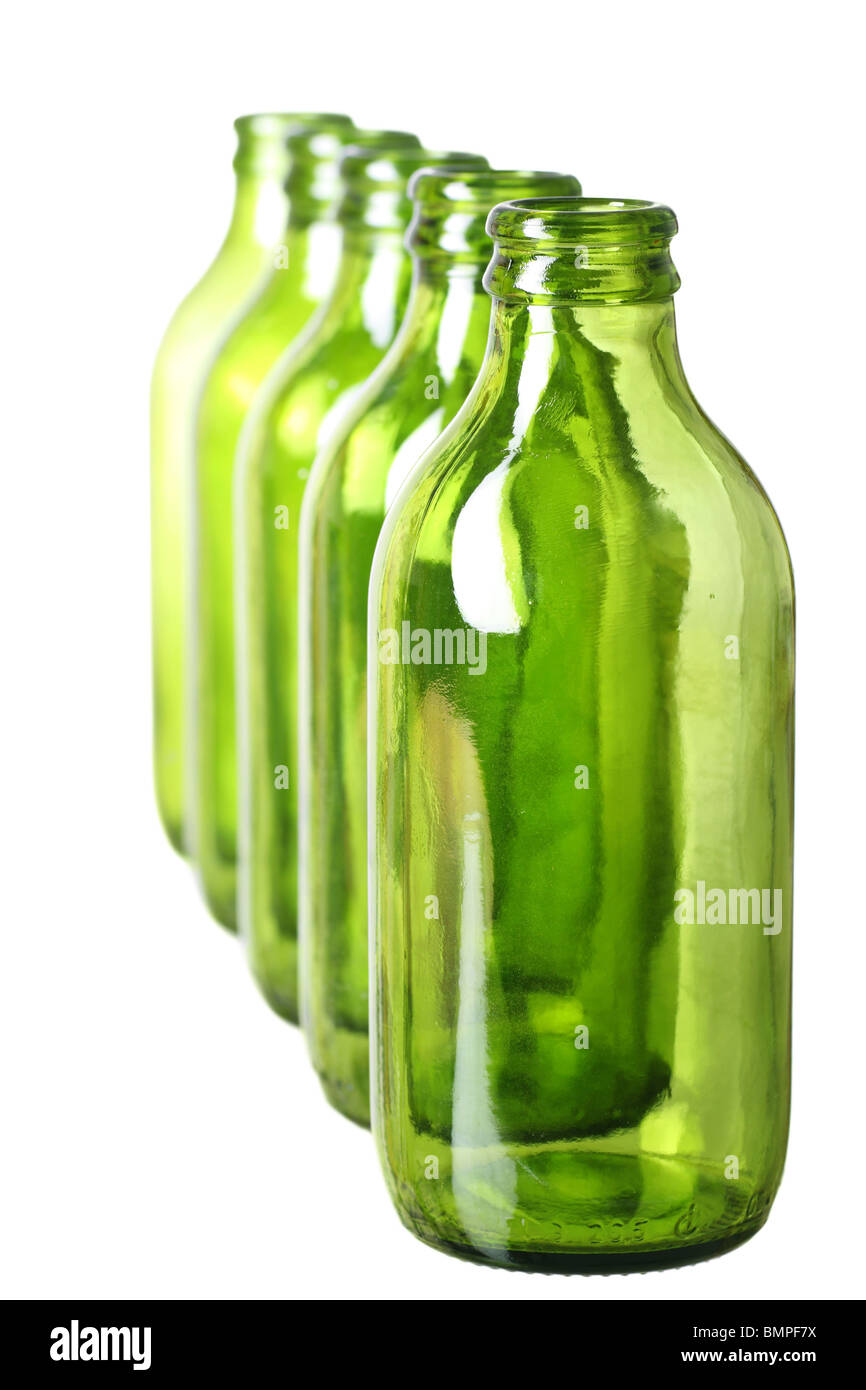five green bottles standing in a row Stock Photo Alamy