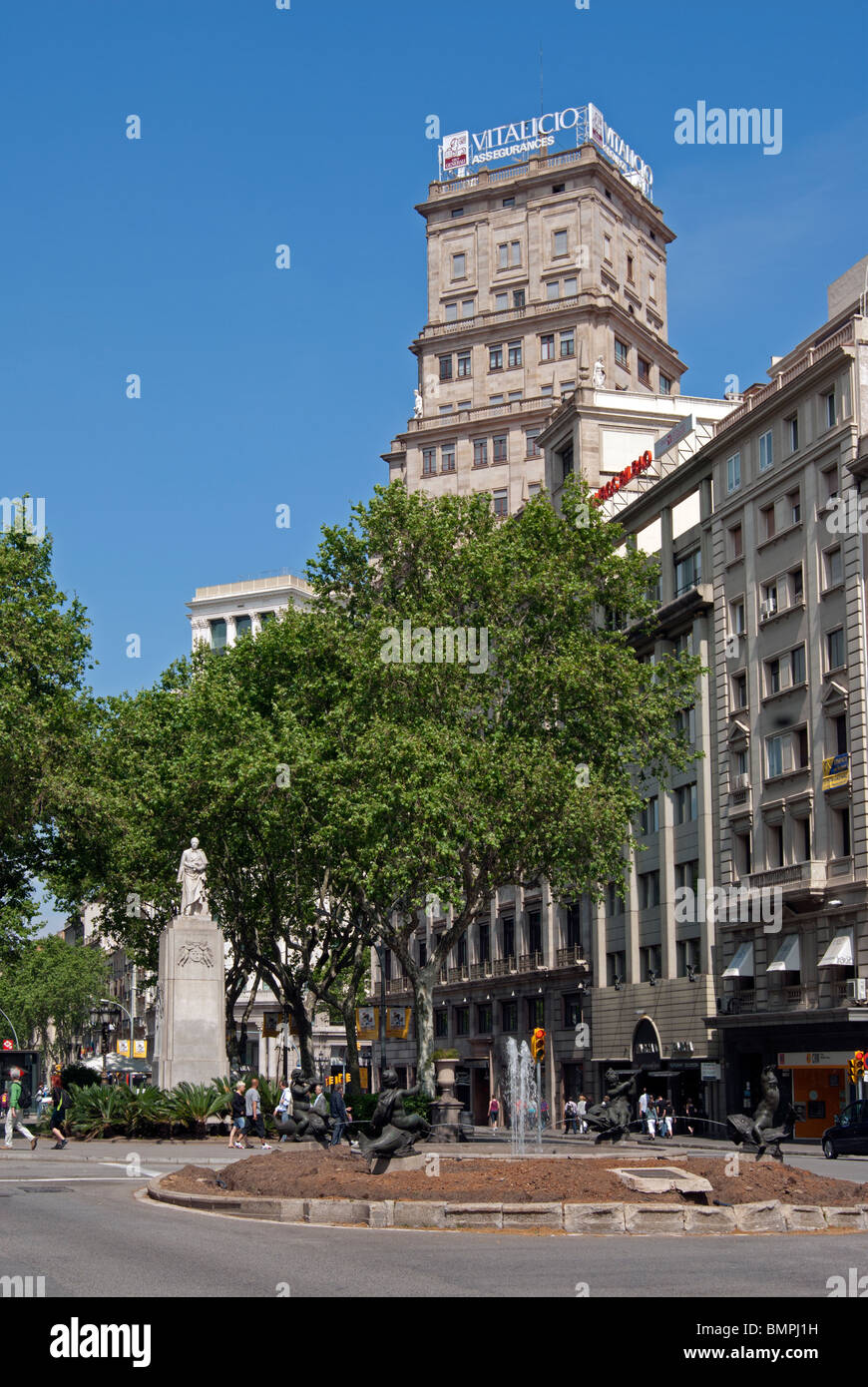Gran Via Corts Catalanes with statue of Guell y Ferrer, Barcelona Stock Photo