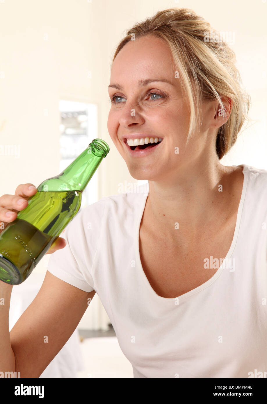 WOMAN DRINKING BEER FROM BOTTLE Stock Photo Alamy