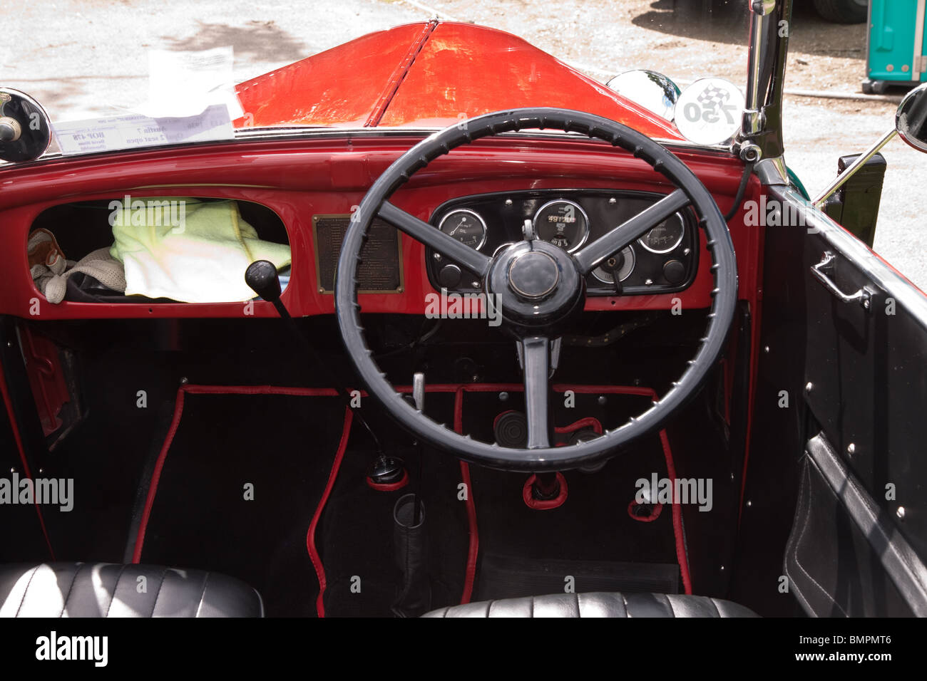 Dashboard and steering wheel in a red Austin 7 classic car Stock Photo