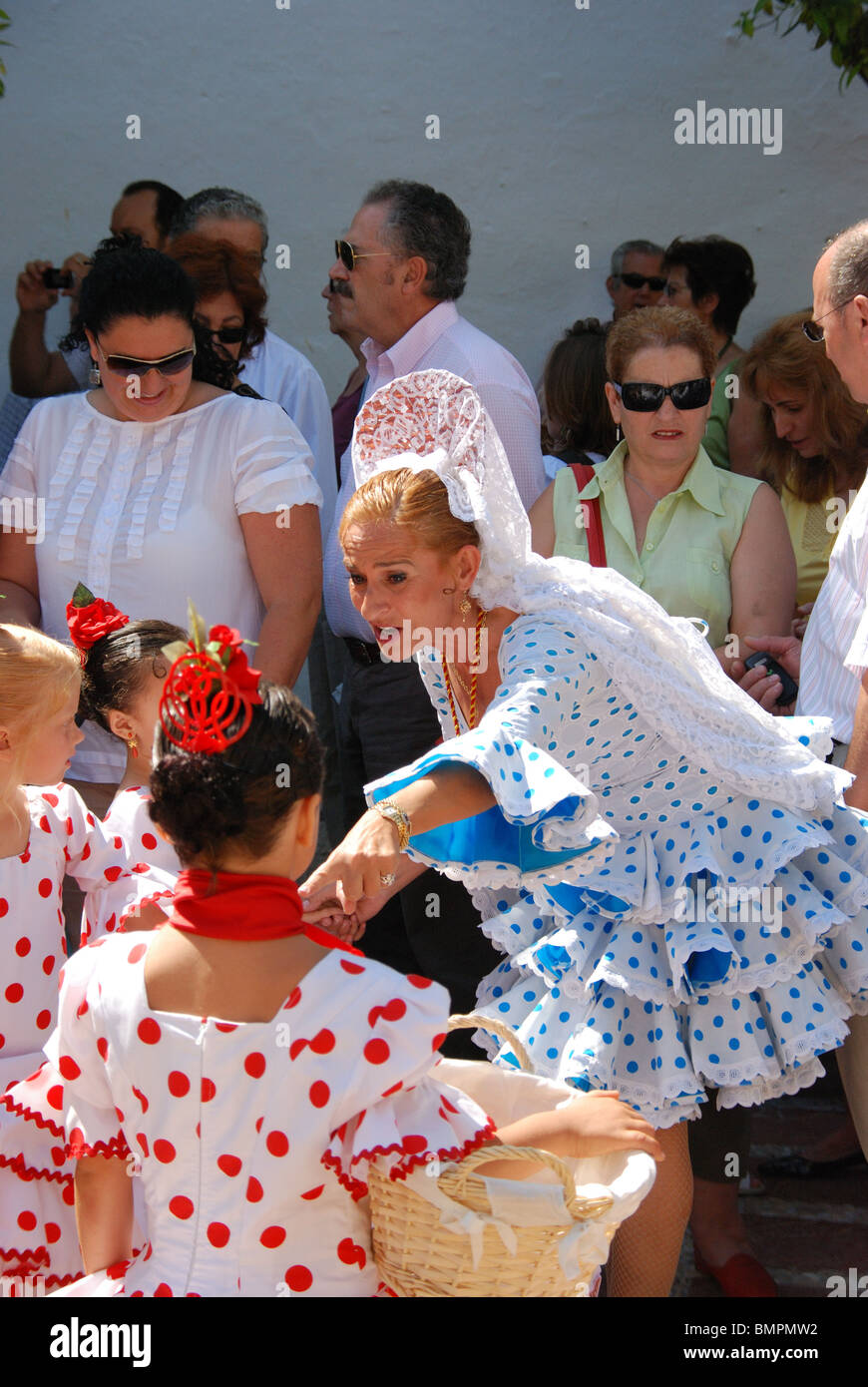 People in traditional dress in the Plaza de la Iglesia, Marbella, Costa