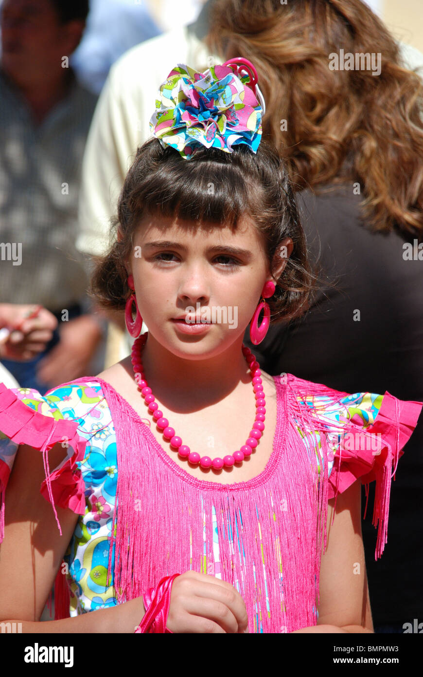 Girl in traditional dress in the Plaza de la Iglesia, Marbella, Costa