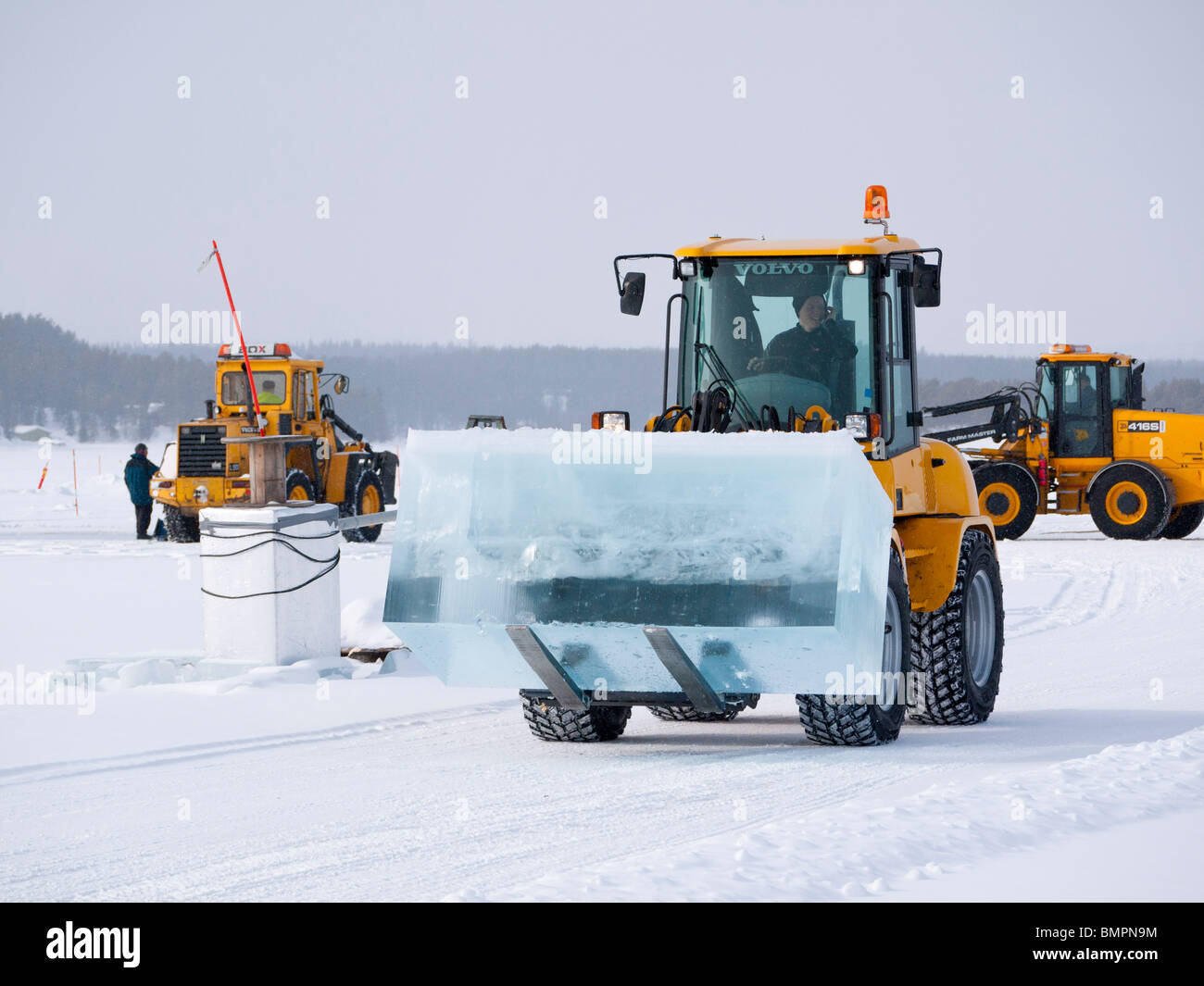 Big blocks of ice are being cut and lifted out from the frozen Torne