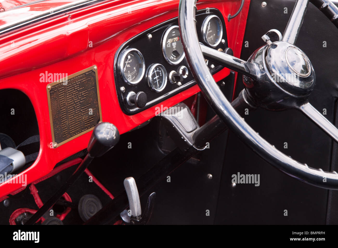 Dashboard and steering wheel in a red Austin 7 classic car Stock Photo Alamy