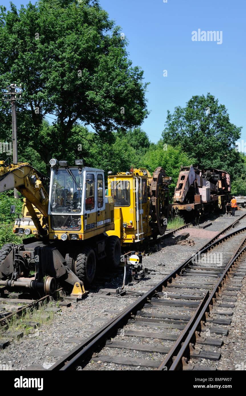 Track Laying Equipment standing in the countryside next to a busy