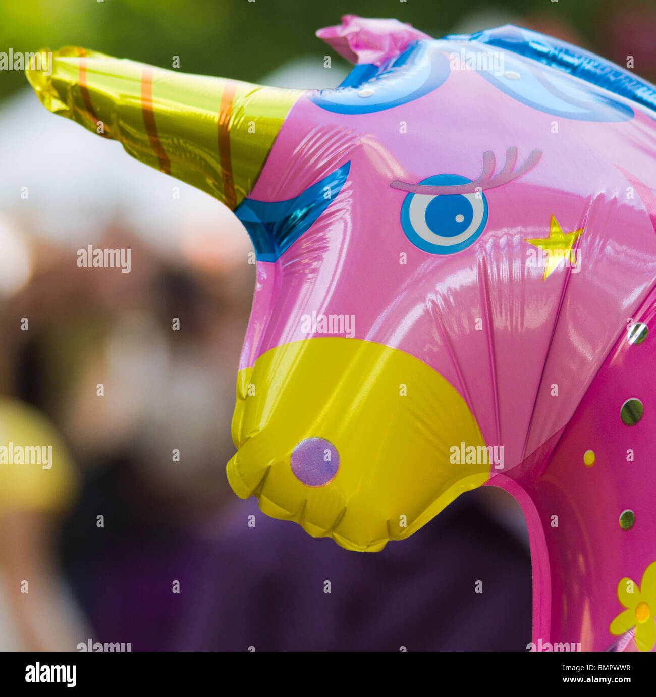 An inflatable unicorn at a city fair Stock Photo