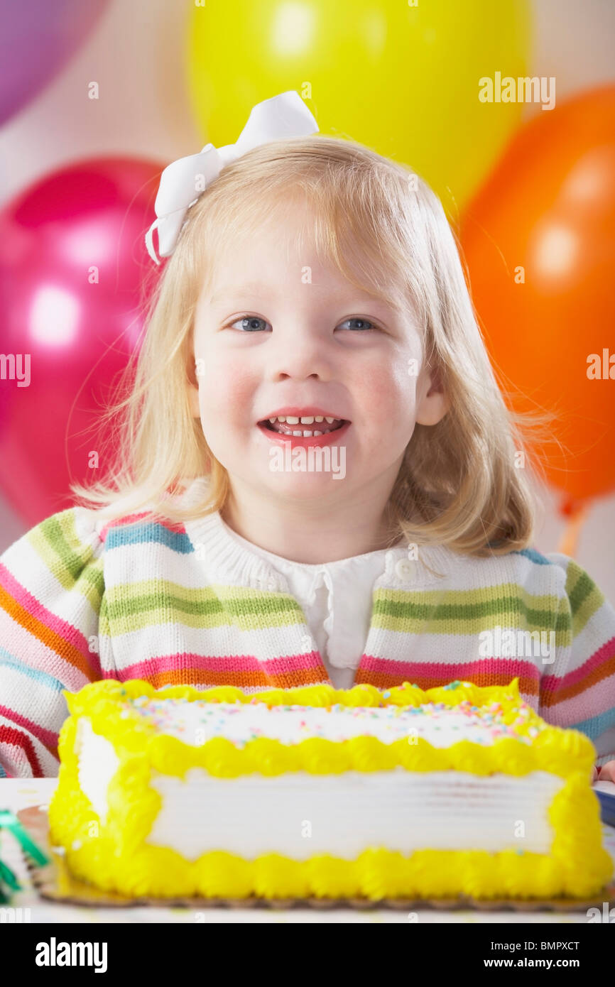 Knoxville, Tennessee, United States Of America; A Young Girl With Balloons And A Birthday Cake Stock Photo