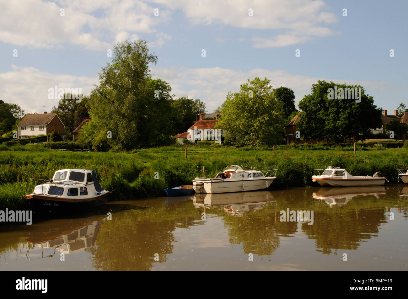 Boats alongside on the River Rother at Newenden Cranbrook Kent England UK Stock Photo