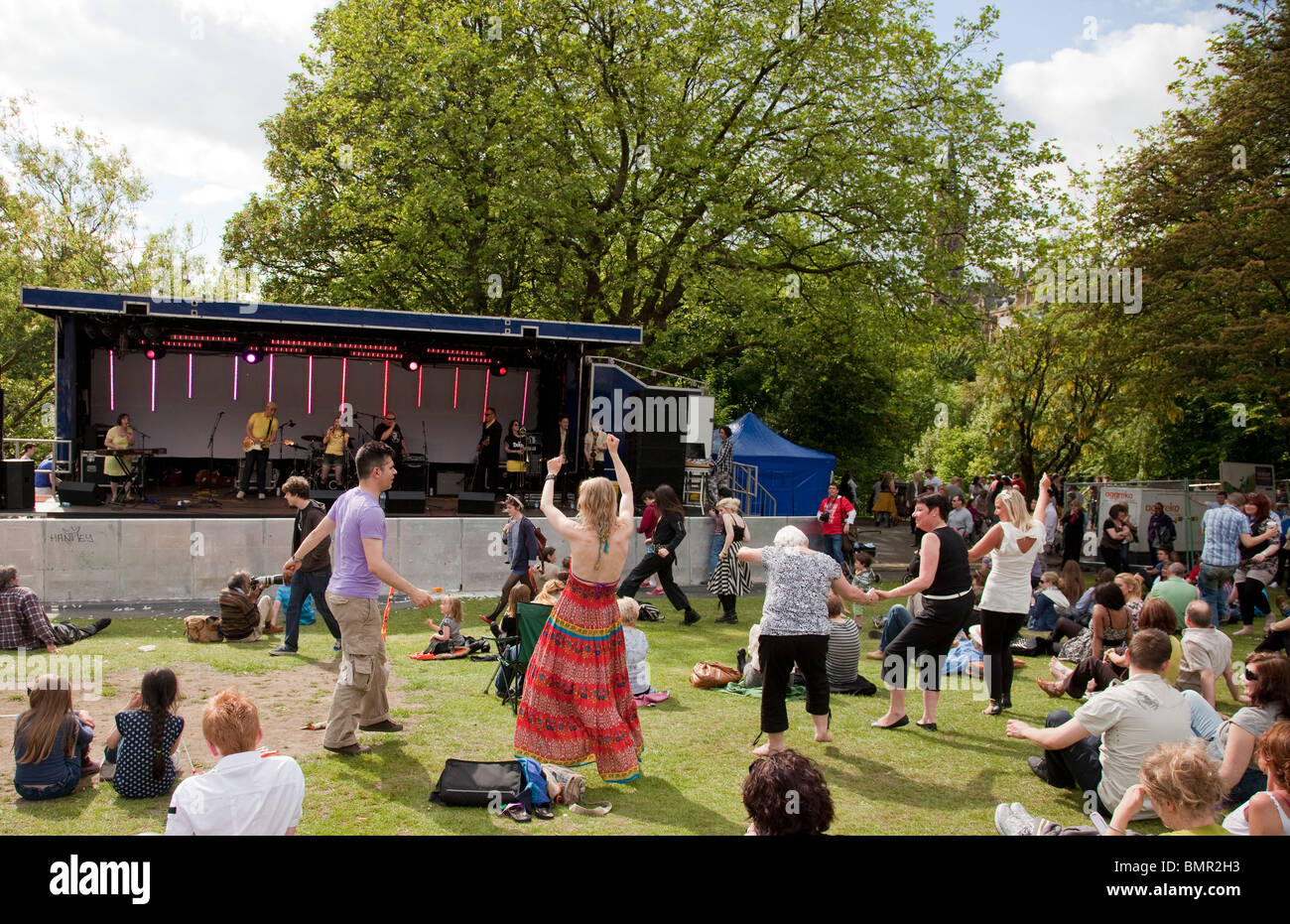People dancing in front of a stage at Glasgow's West End Festival Sunday, 2010, in Kelvingrove Park. Stock Photo