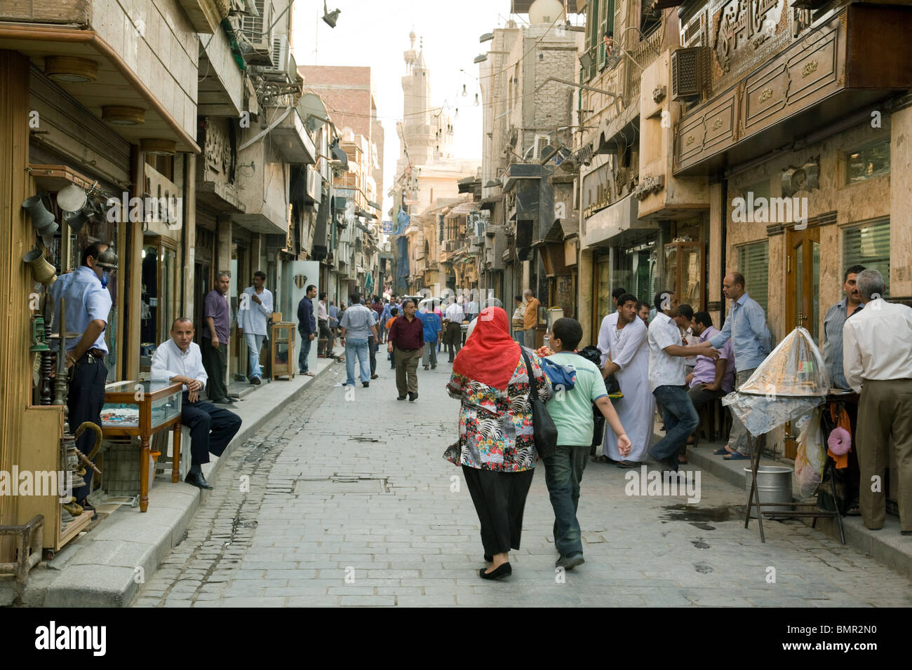 Street scene Cairo; Everyday life Egypt; people in the Khan al Khalili market, Islamic quarter, Cairo Egypt Stock Photo