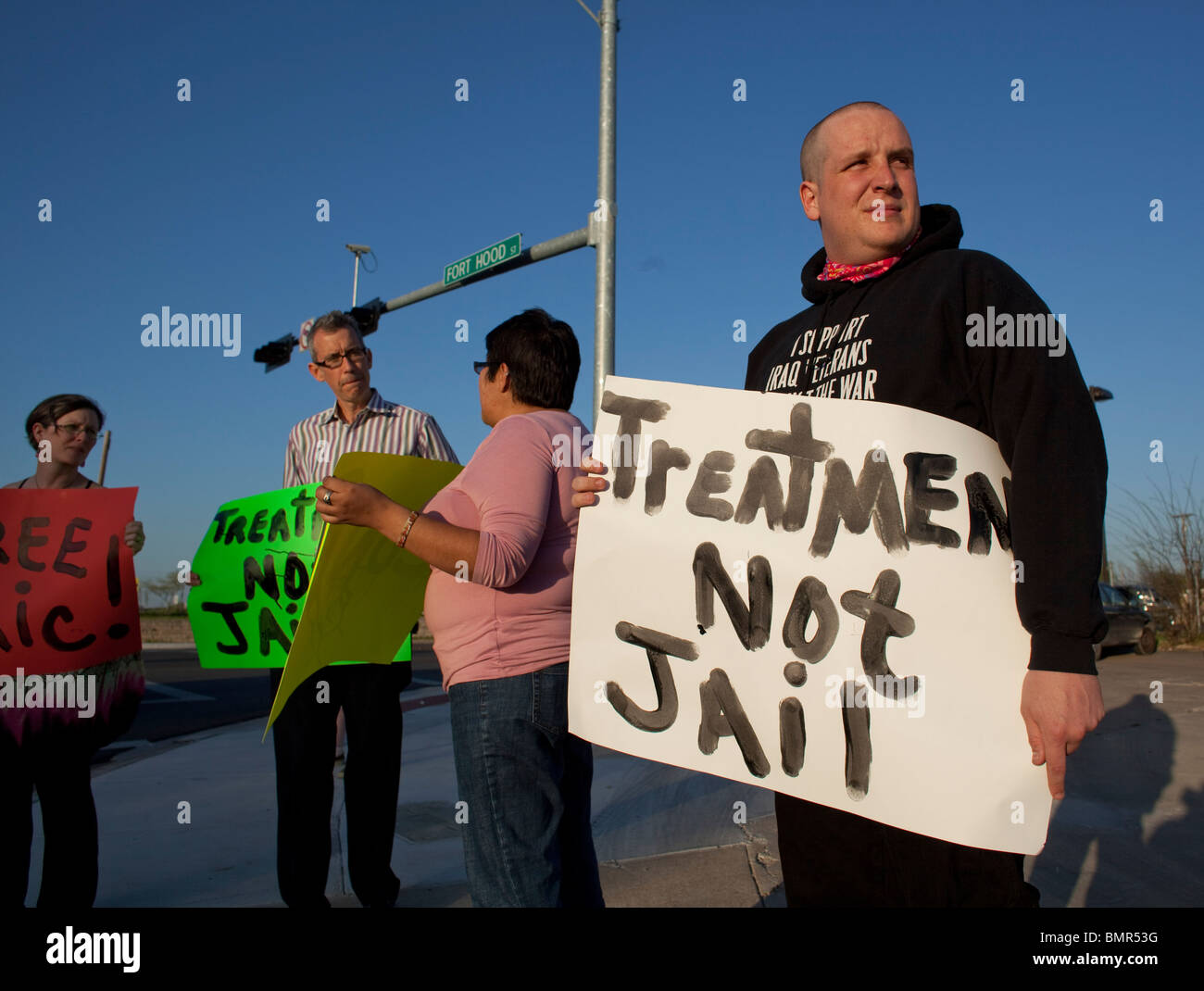 Iraq War veteran Michael Kern (r) organizes a protest outside of Fort Hood for post traumatic stress disorder (PTSD) victims. Stock Photo