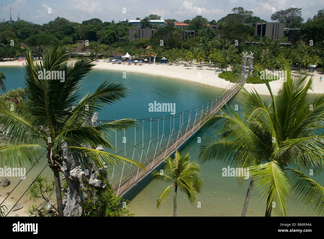 Suspension bridge and Palm trees and Beach, Sentosa Island, Singapore Stock Photo