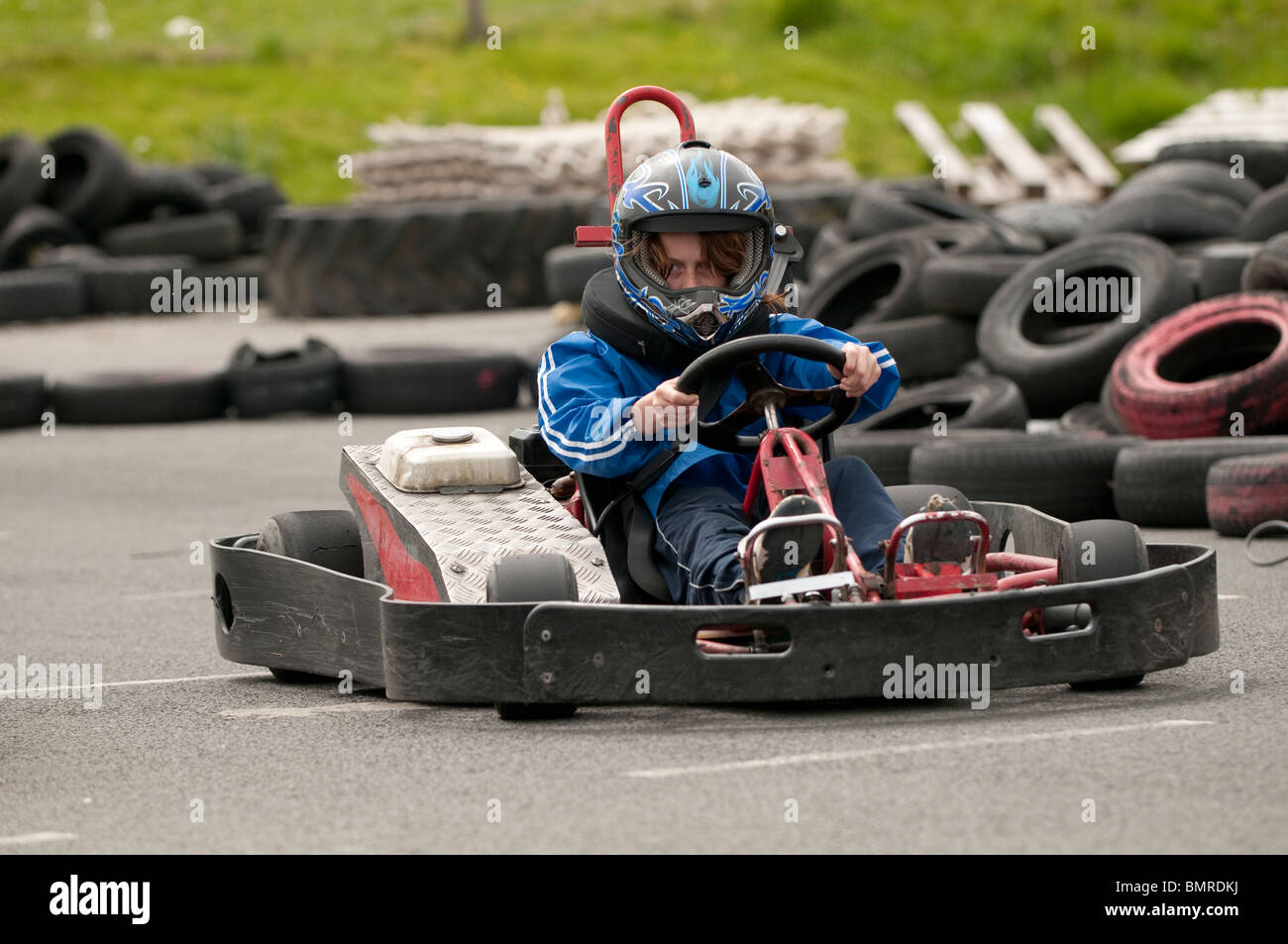 Schoolchild driving a gokart at The Urdd Centre, Llangrannog, Ceredigion, West Wales UK Stock
