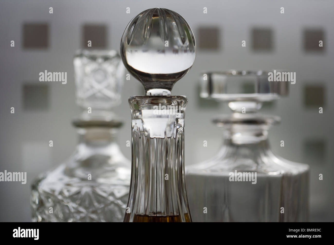 Three spirits crystal carafes, decanters Stock Photo