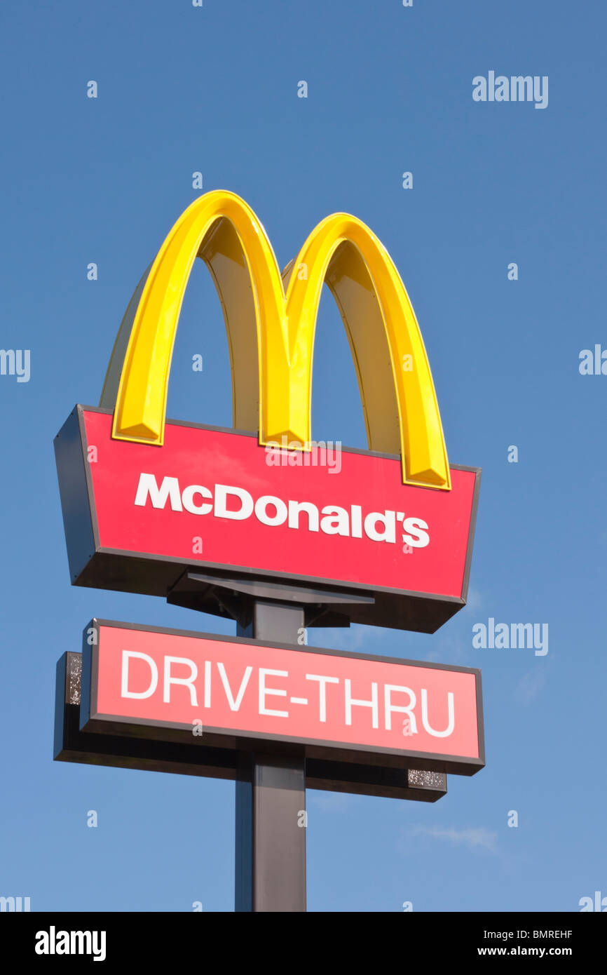 Macdonalds drive through sign against clear blue sky Stock Photo