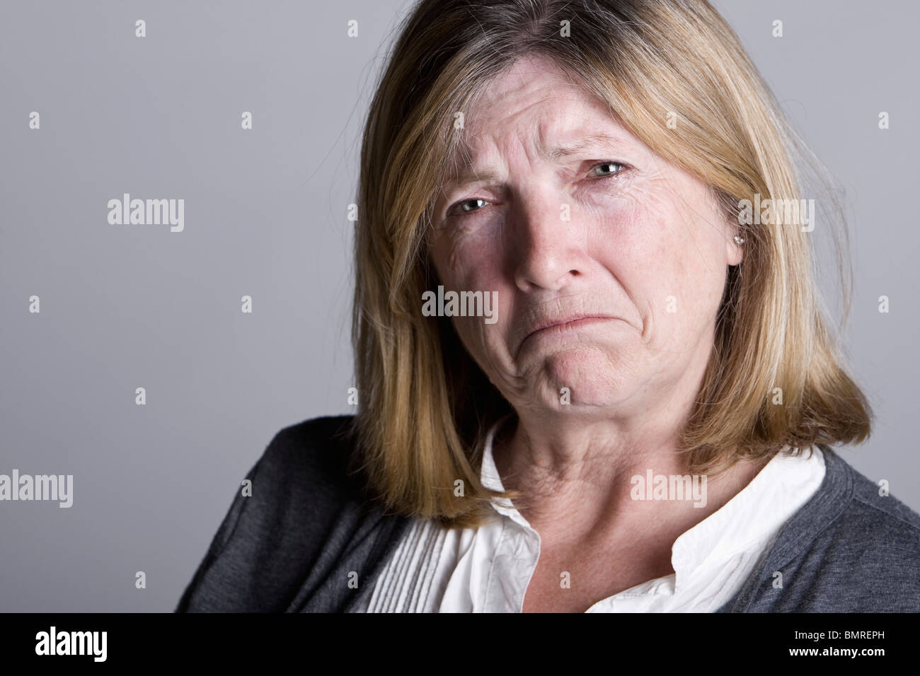 Powerful Shot of a Sad Looking Senior Lady Stock Photo