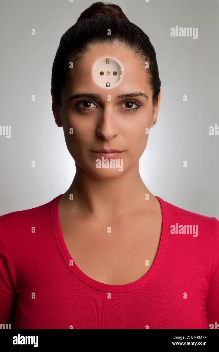 Woman with an electrical plug in, in her forehead Stock Photo Alamy