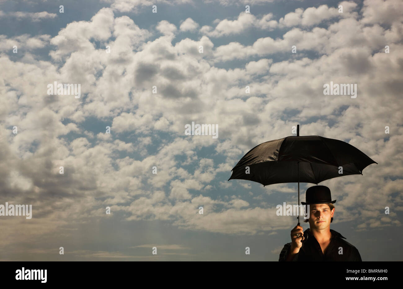 Bowler hat man umbrella hi-res stock photography and images - Alamy