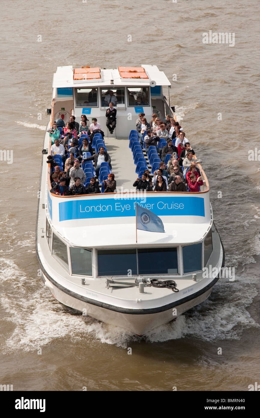 Sightseers on a boat trip on the River Thames Stock Photo