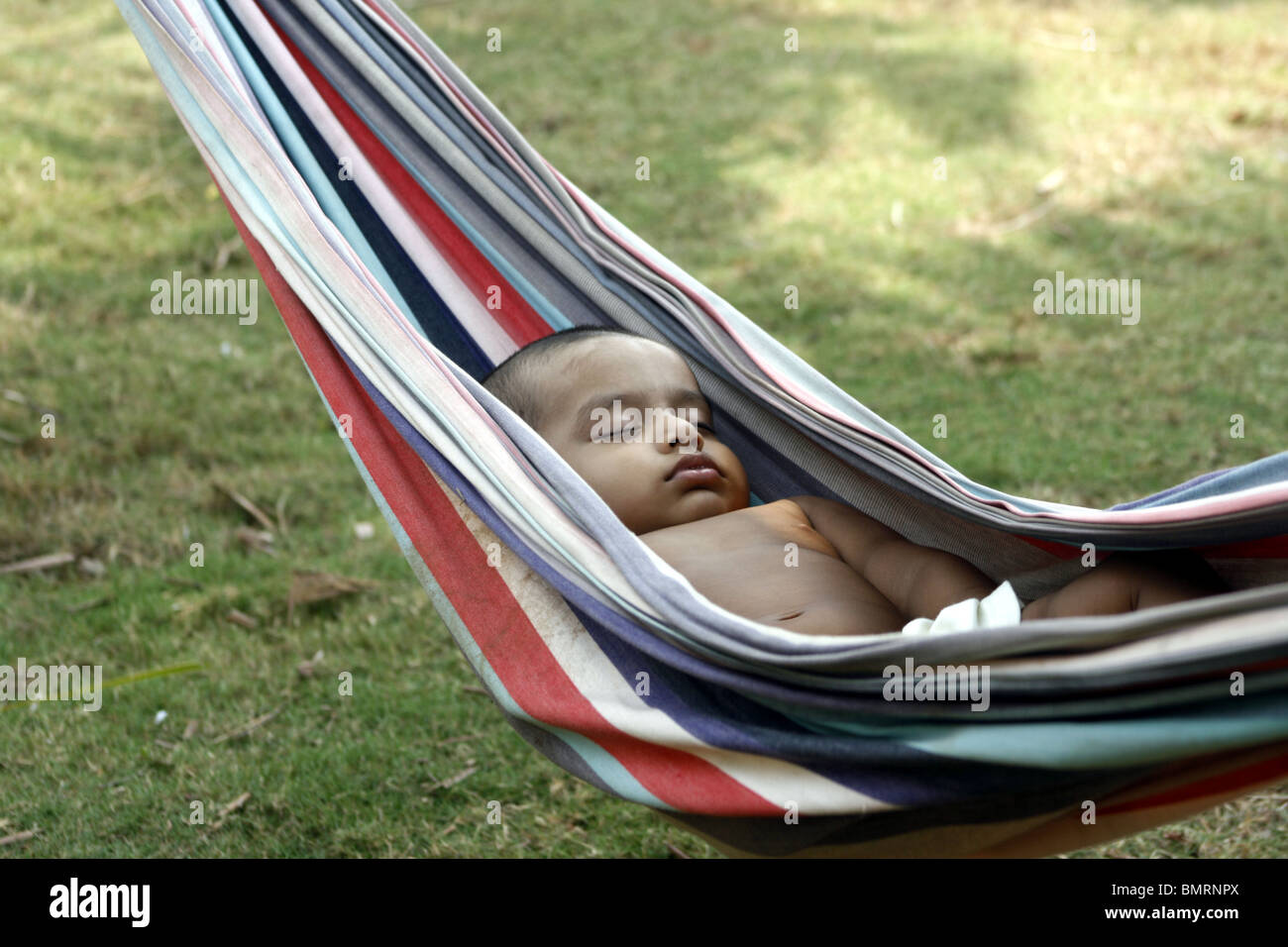 1 year old Asian baby sleeping on a hammock Stock Photo