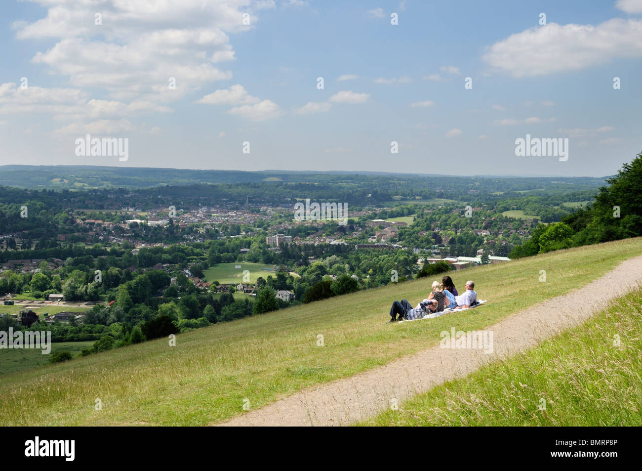 A group of people enjoying the view of Dorking from Box Hill in Surrey, England. Stock Photo