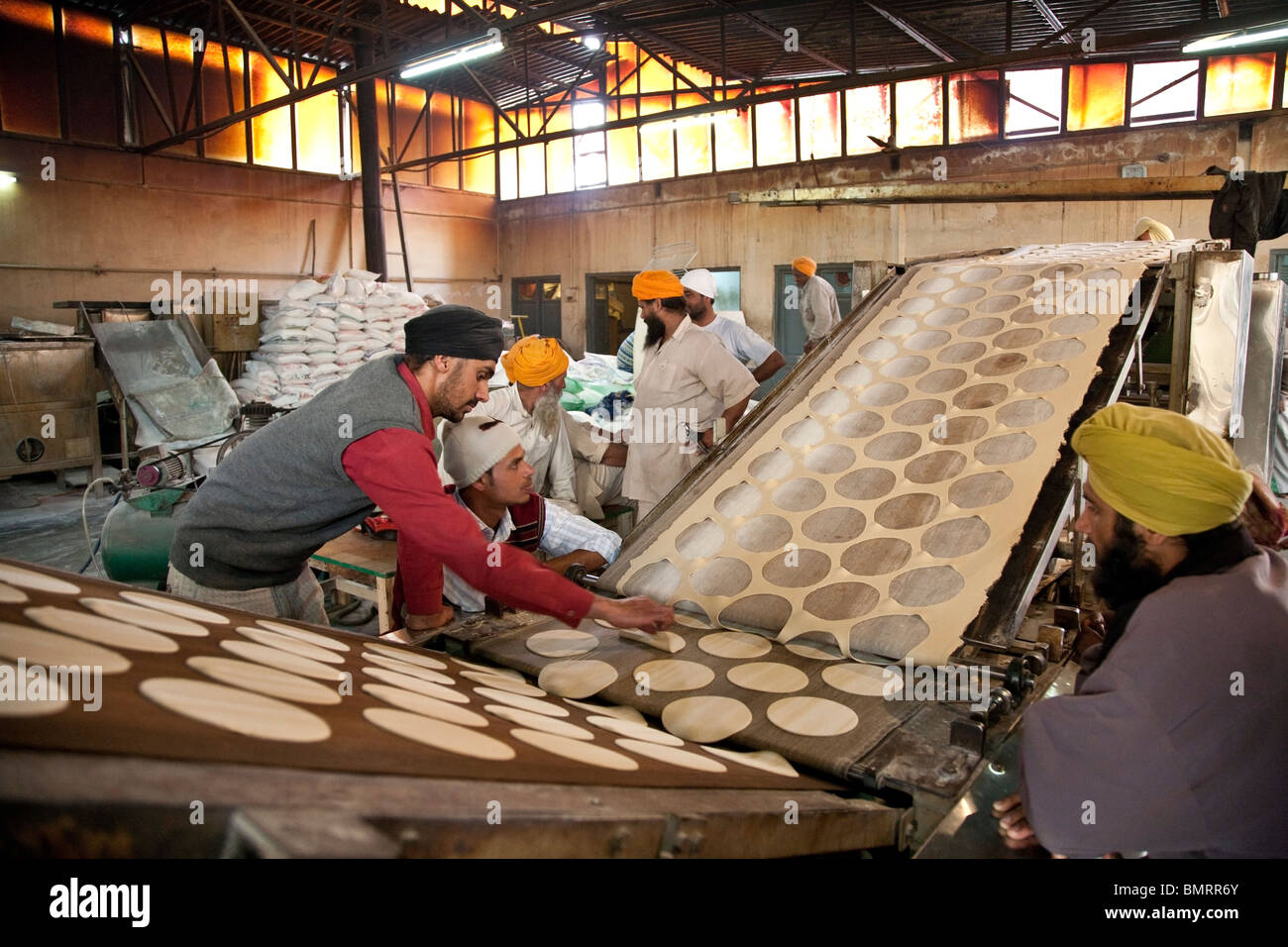 Bread machine (chapatis). This bread is offered to the pilgrims. The Golden Temple. Amritsar. India Stock Photo