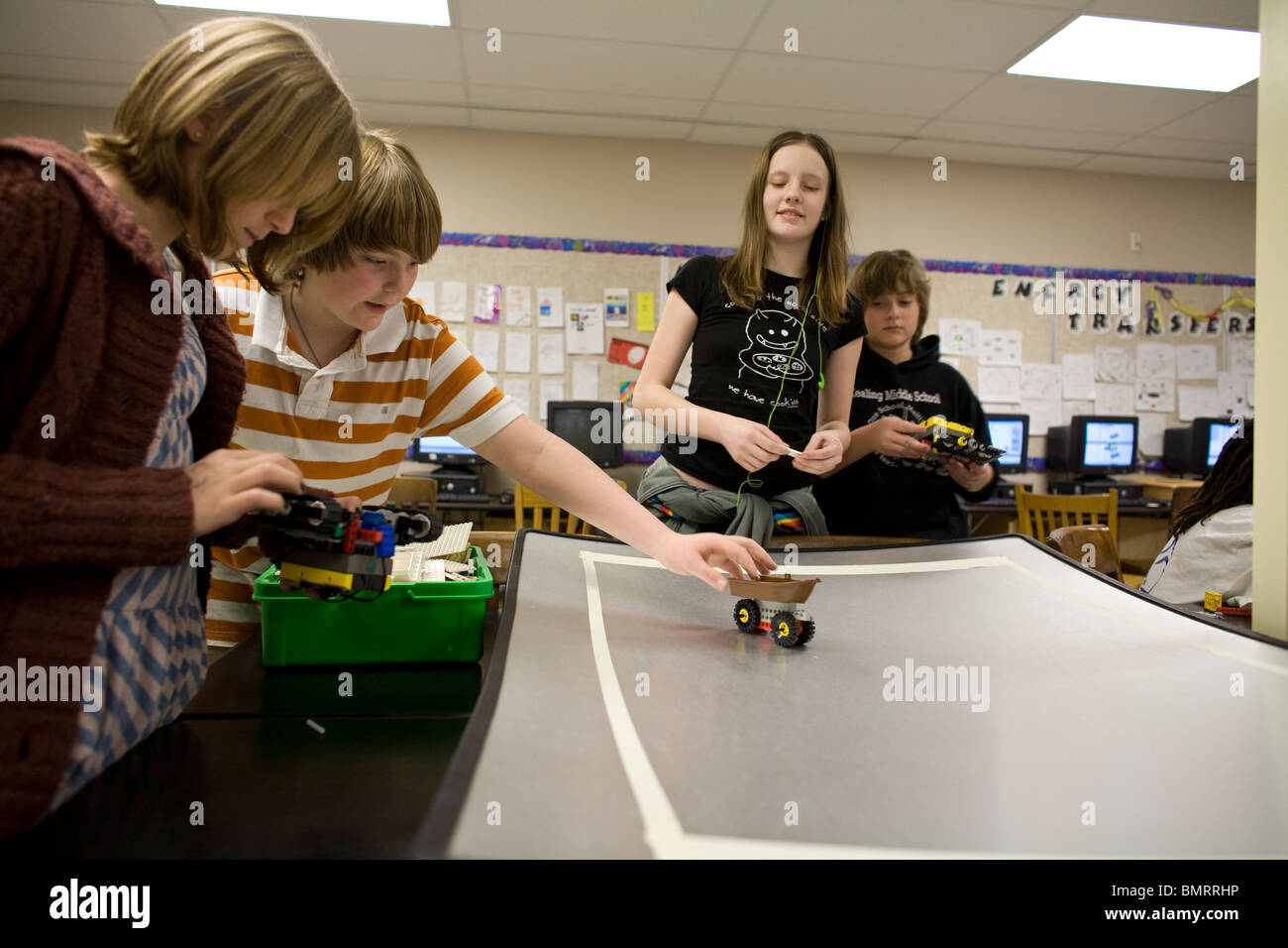 Students work on a radiocontrolled vehicle during robotics class at a public math and science