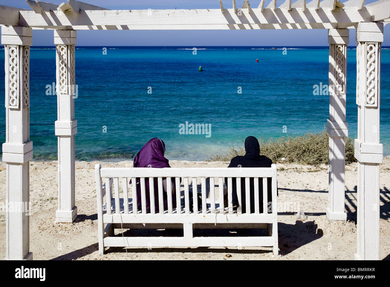 Two woman see the sea. Matruh beach. Egypt Stock Photo