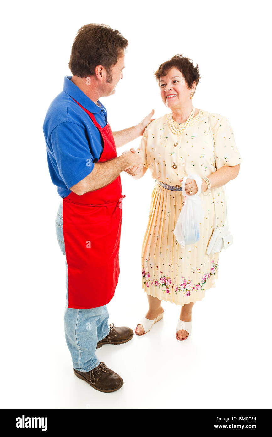 Salesman shakes hands with a happy customer. Isolated on white. Stock Photo
