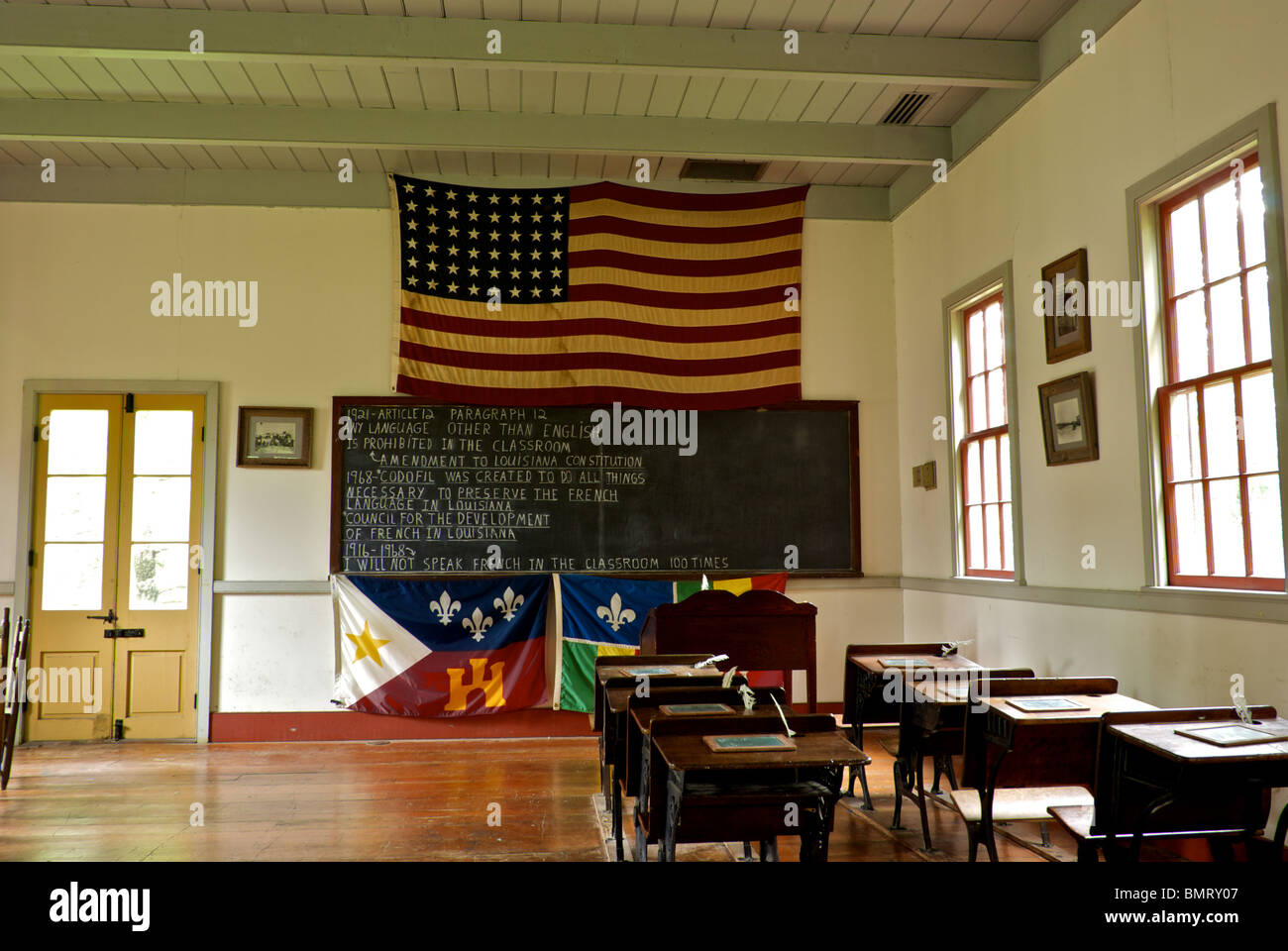 Wooden desks old classroom Vermilionville Cajun Creole heritage folklife park recreates Acadiana LA 1765 to 1890 Stock Photo