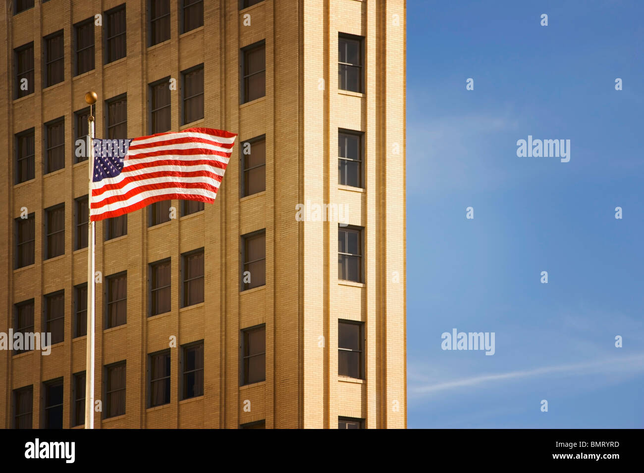 San Antonio, Texas, United States Of America; An American Flag In Front Of A Building Stock Photo