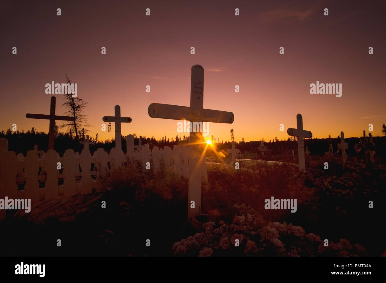 Inuvik, Northwest Territories, Canada; Cemetery In The Arctic At Sunset Stock Photo