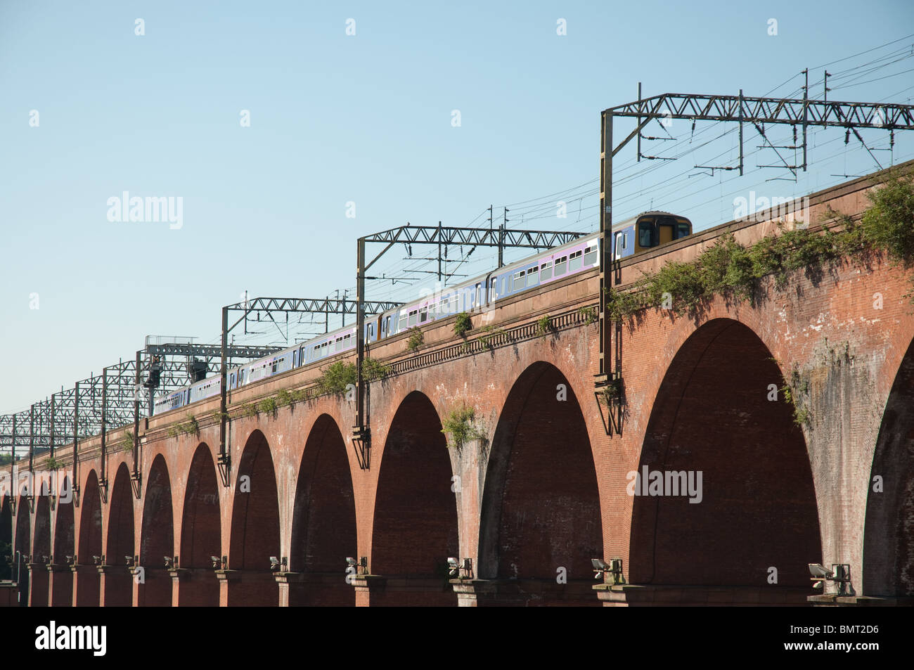 Train traveling across Stockport viaduct, opened in 1840 the structure