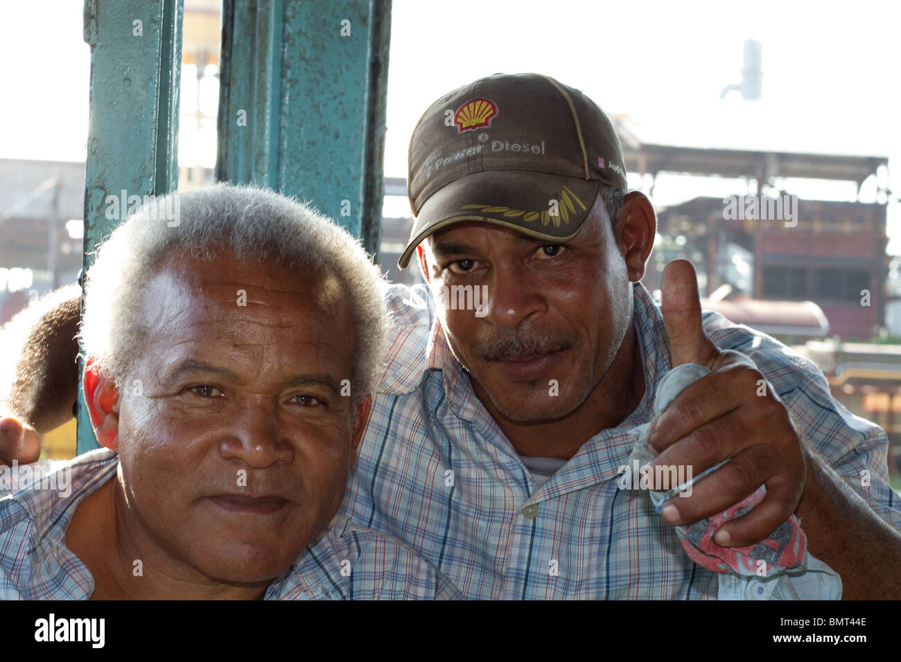 Two Cuban Steam Locomotive Train Drivers Posing For A Photo In Their Steam Train Cab Stock Photo