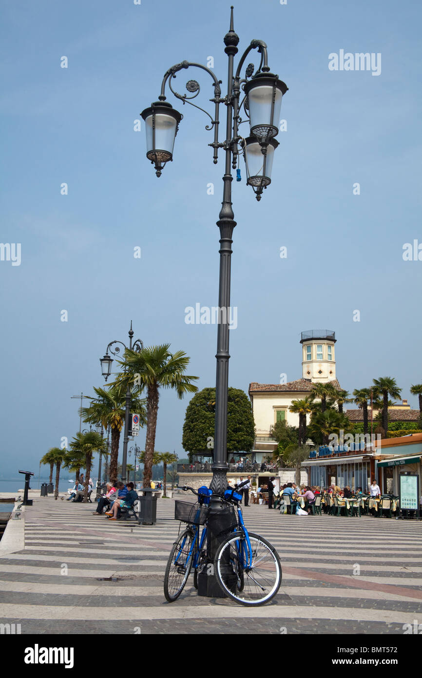 Bikes by a lamppost on the waterfront in Lazise Lago di Garda