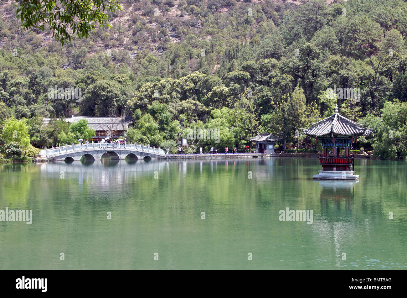 Bridge and gazebo in lake Black Dragon Pool Park Lijiang Yunnan China Stock Photo