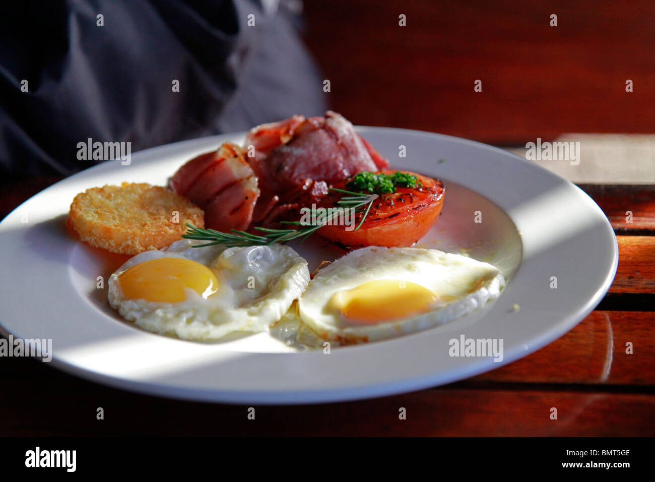 Breakfast plate with eggs, bacon tomato and hash browns at The