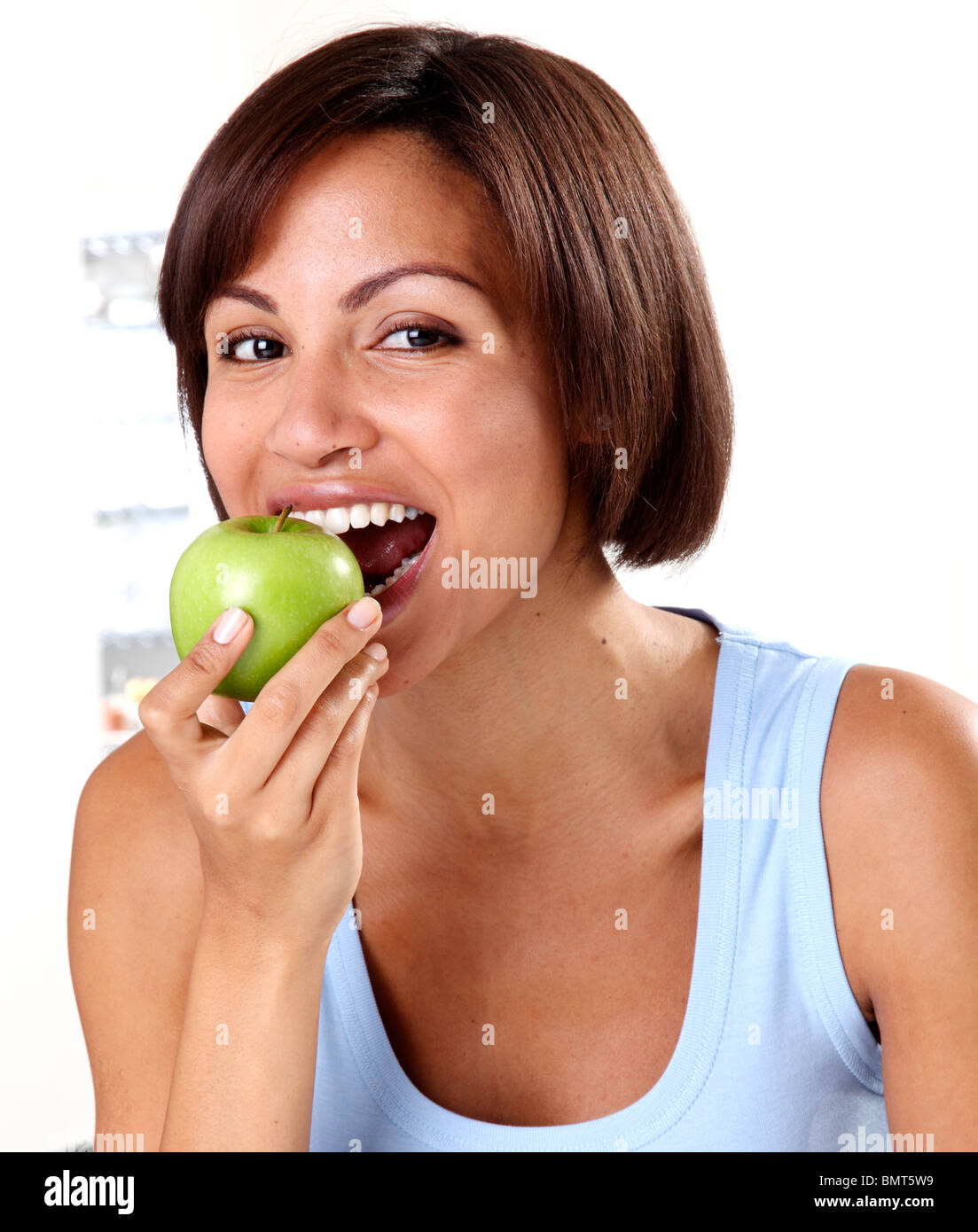 WOMAN EATING A GREEN APPLE Stock Photo Alamy
