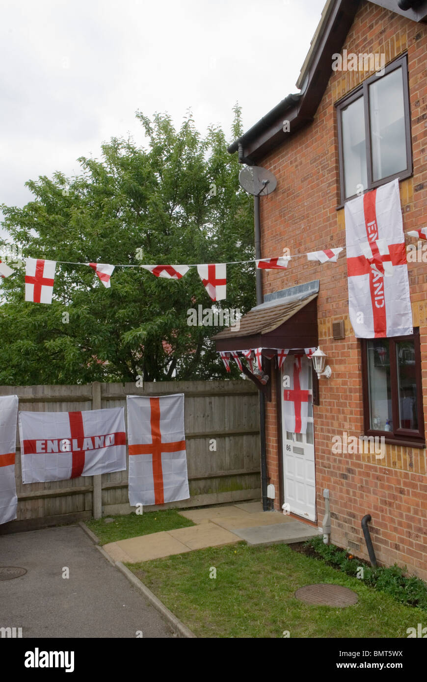 English flag flags decorated house football world cup excitement. London 2010 2010s UK England HOMER SYKES Stock Photo