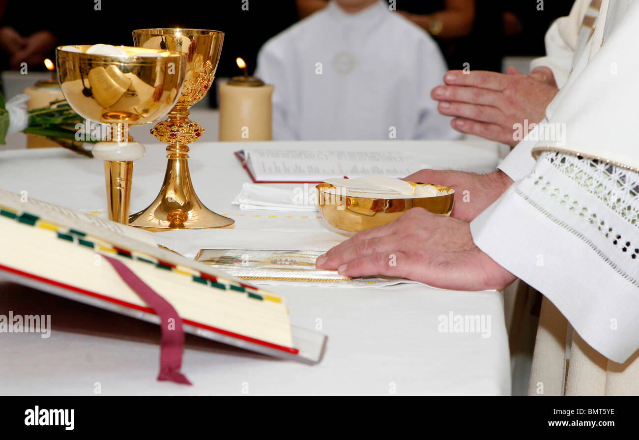 hands of priest by the mass Stock Photo