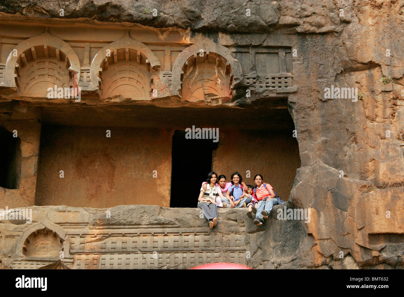 Indian tourists enjoying at heritage site of Bhaja caves built in reign of king Ashoka ; Lonavla ; Maharashtra ;  India Stock Photo