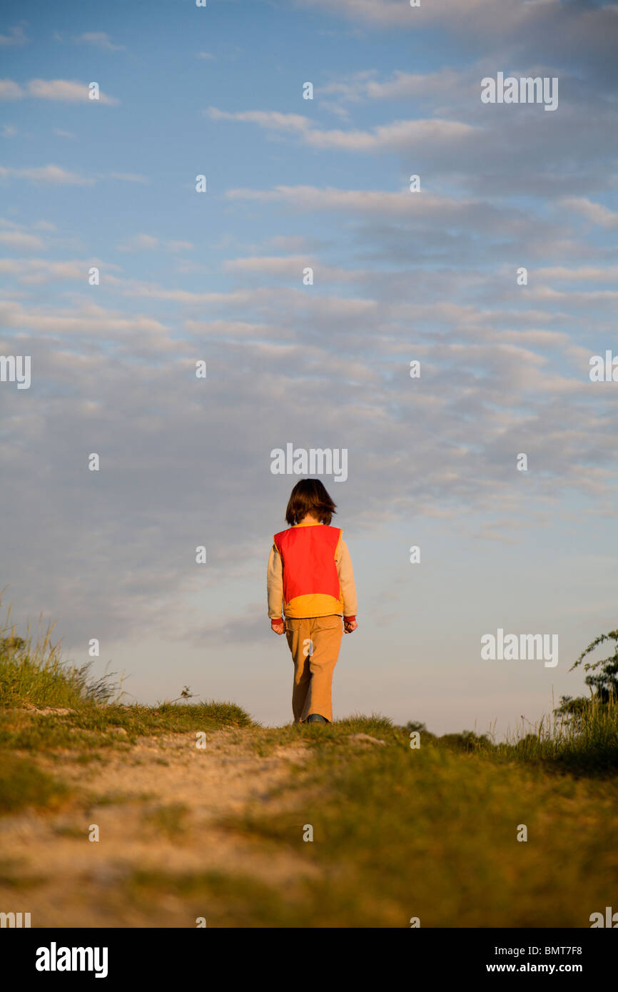 little girl on the way - evening Stock Photo