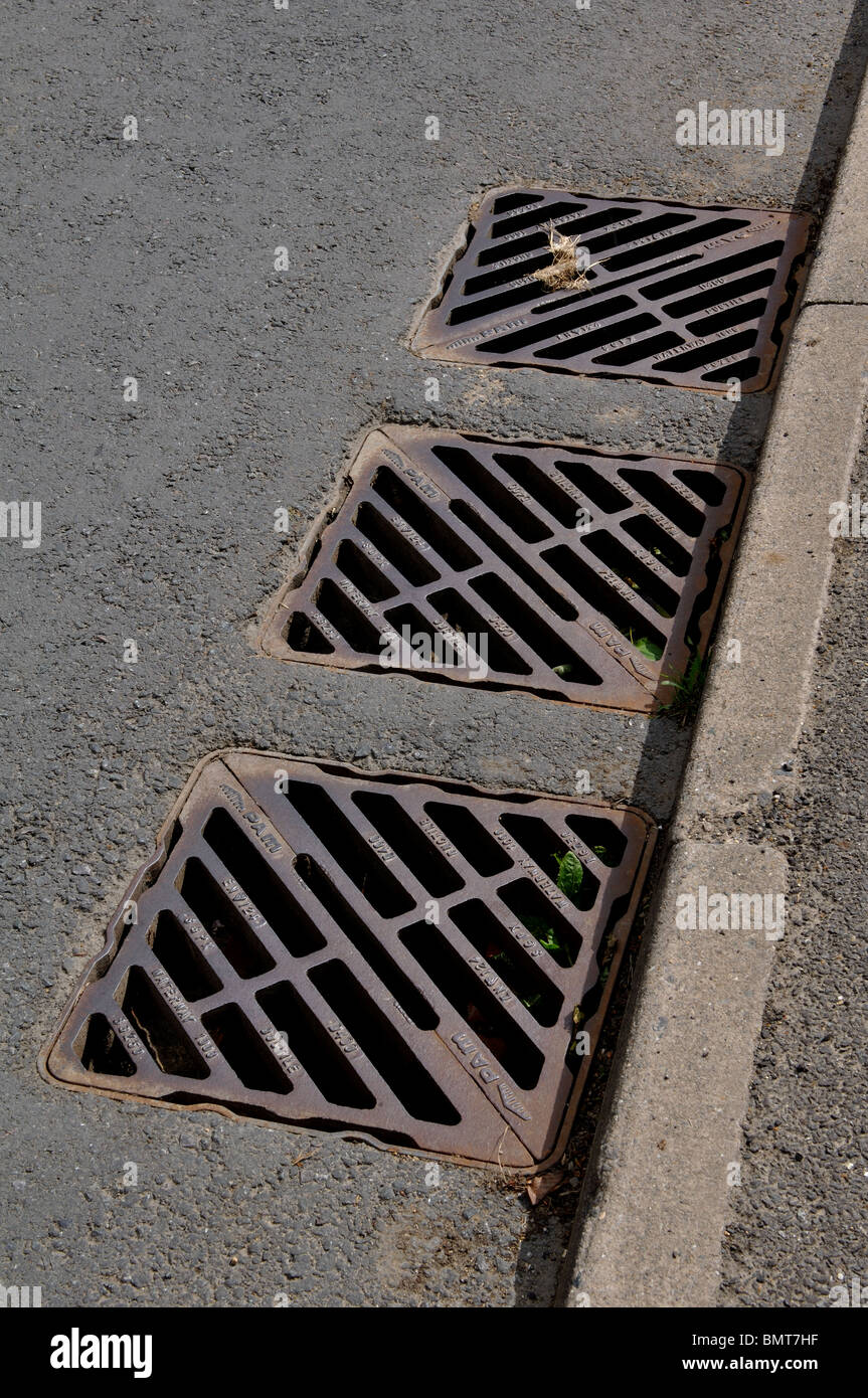 Drain covers in road Stock Photo Alamy